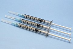 Three syringes with emulsion